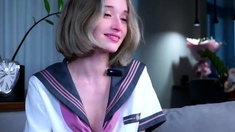 Blonde teen in solo action with her pussy