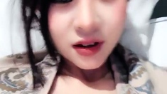 Amateur Asian teen sucks a big cock
