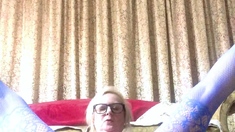 Mature blonde in stockings dildos her sweet cunt