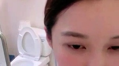 Asian babe sucking and jerking two hard dicks