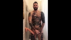 Tatted Hunk Fucks Dildo in Shower Until He Cums